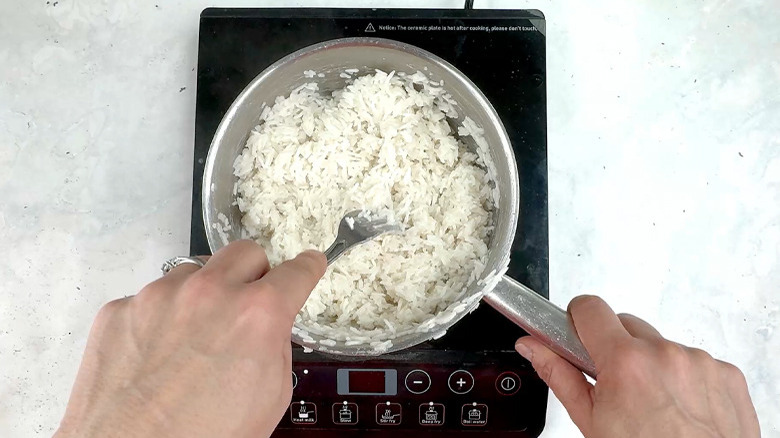 Fluffing rice with fork