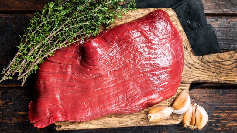 flank steak and garlic cloves