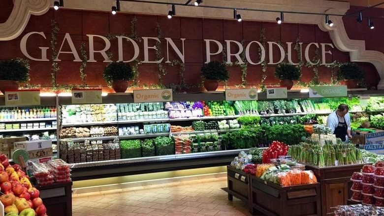 Man stocking Gelson's produce