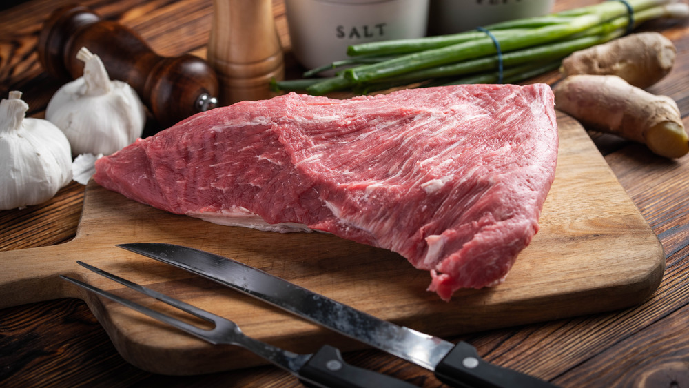 Tri-tip on wooden cutting board