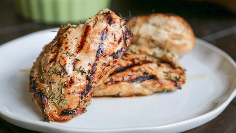 Seasoned chicken breasts on plate