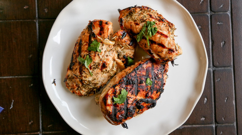 Grilled chicken breasts on plate
