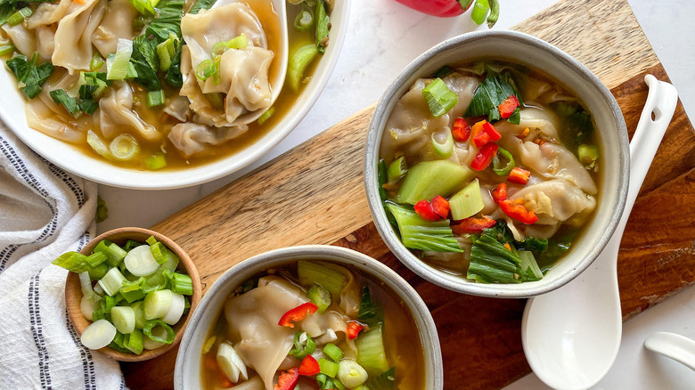 Vegetable wonton soup in bowls