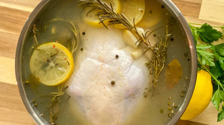 raw chicken in liquid