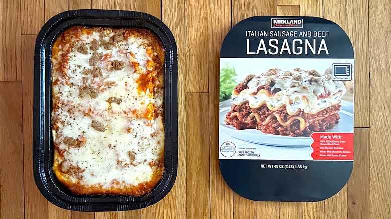 Kirkland Signature Italian Sausage and Beef Lasagna box and baked lasagna in a black container