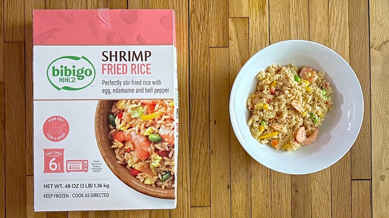 Bibigo Shrimp Fried Rice box and cooked rice in a white bowl