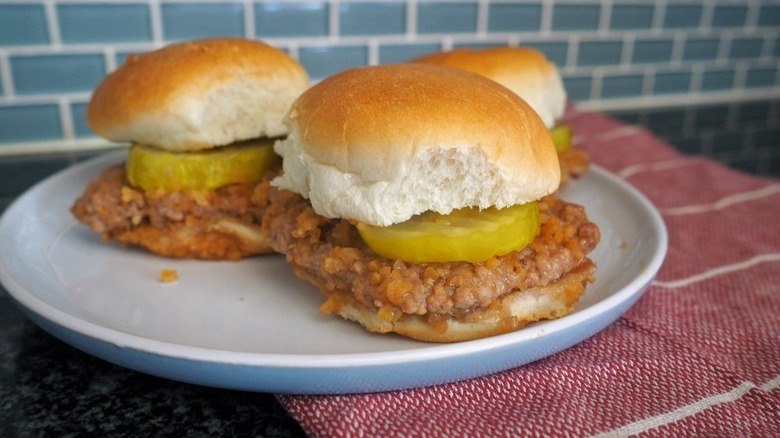 small square burgers with pickles