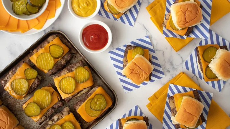 small square cheeseburgers with pickles