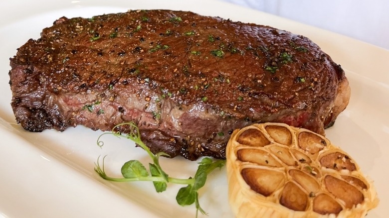 Steak with roasted garlic at Truluck's