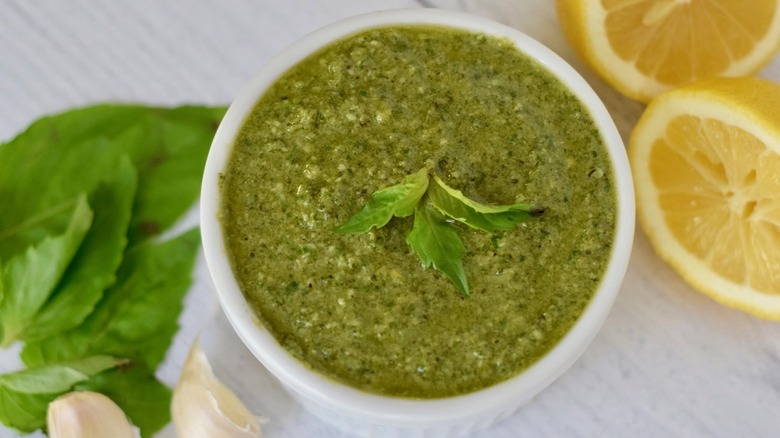 ramekin of basil pesto withe lemon on side