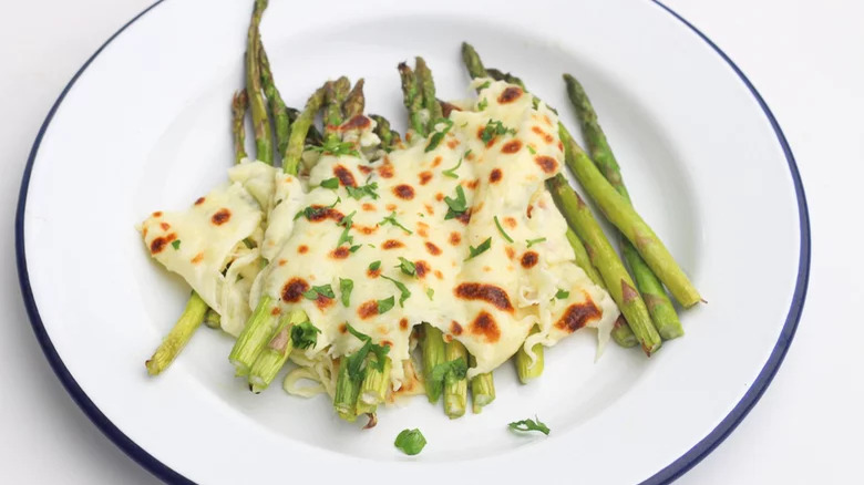 plate of cheesy baked asparagus