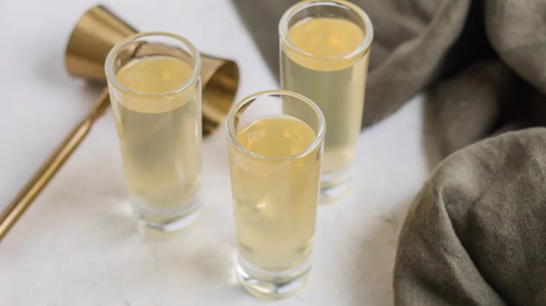 three green tea shots in shot glasses