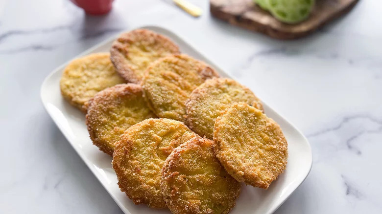 sliced fried green tomatoes on plate