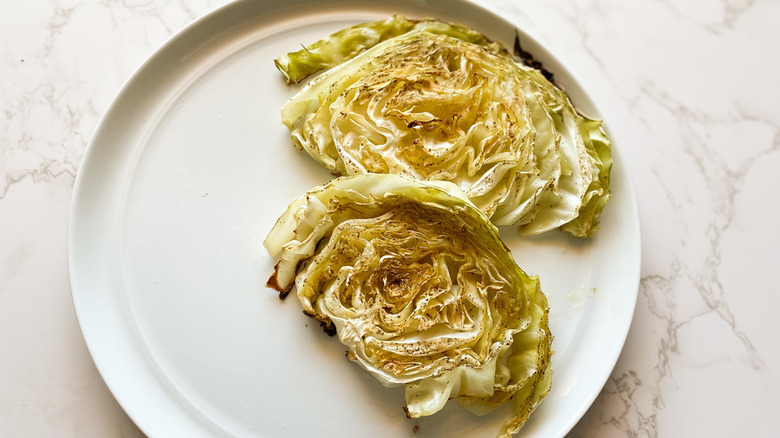 sliced cabbage steak on plate