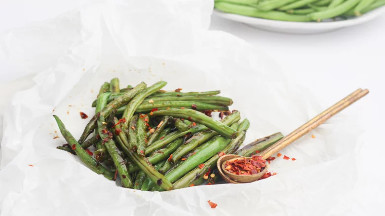 bowl of Spicy Szechuan Green Beans with spices