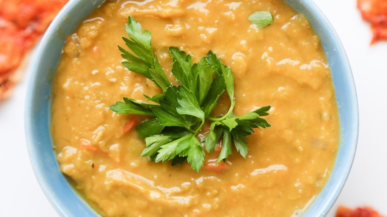 bowl of split pea soup with garnish