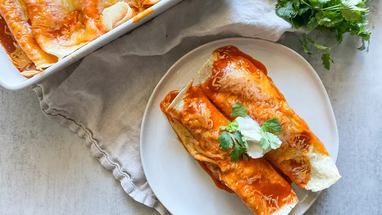 two enchiladas with sour cream