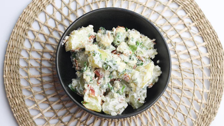 potato salad in black bowl