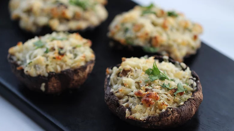 stuffed mushrooms on black board