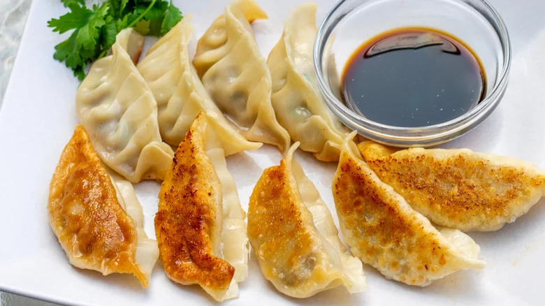 gyoza on plate with sauce