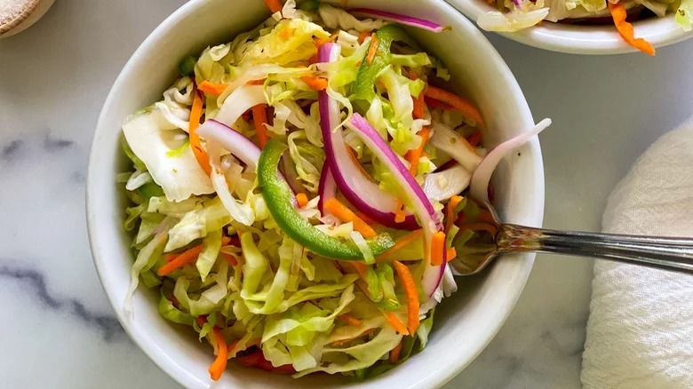 bowl of curtido with fork