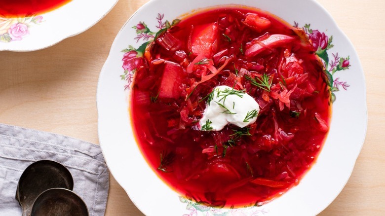 bowls of borscht with spoon