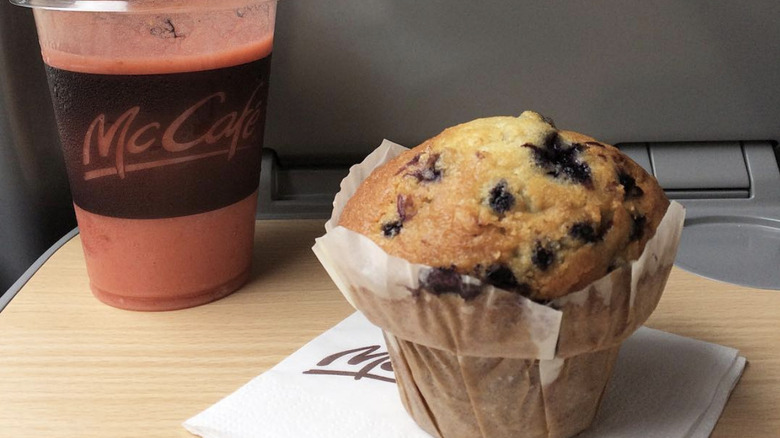 McDonald's blueberry muffin on a napkin with a McCafe smoothie