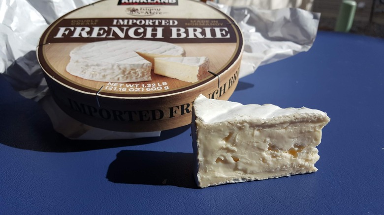 Slice and wheel of brie