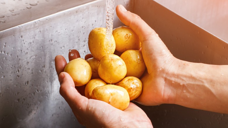 washing potatoes