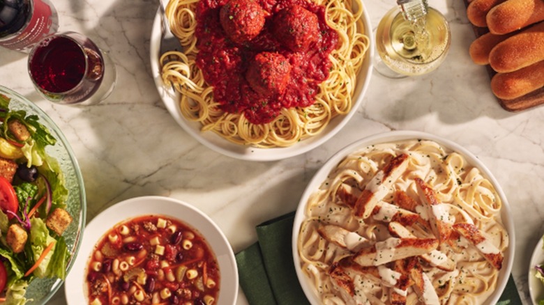 Table filled with Olive Garden dishes