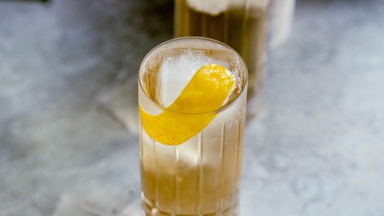 cocktail with lemon peel garnish