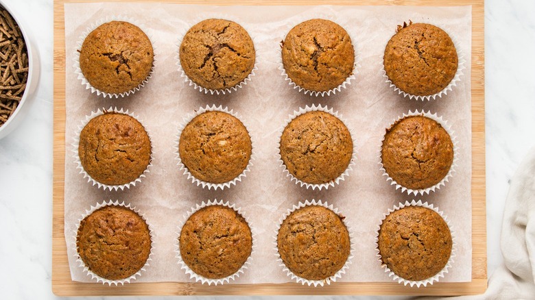 bran muffins on wooden board