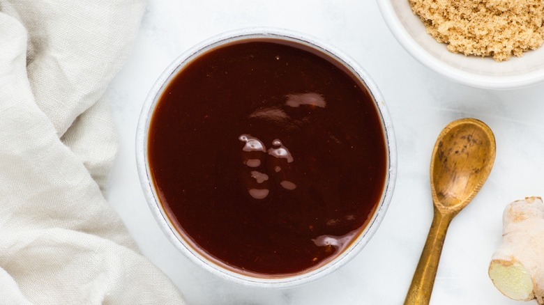 brown sauce in white bowl