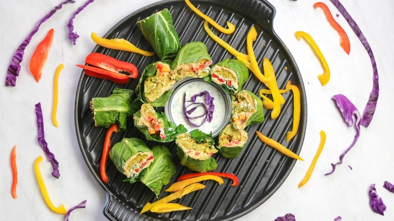 dish with collard wraps tzatziki colorful vegetables