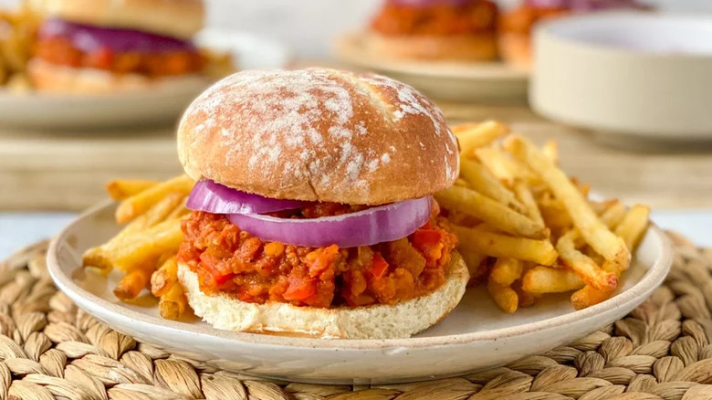 vegan sloppy joe on plate with french fries