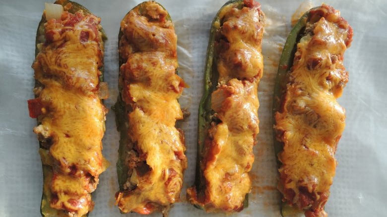 four zucchini enchilada boats