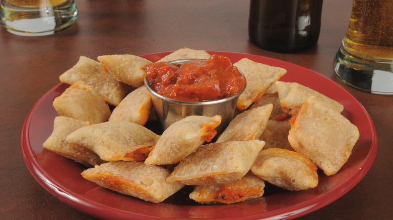 plate of totino's pizza rolls and sauce