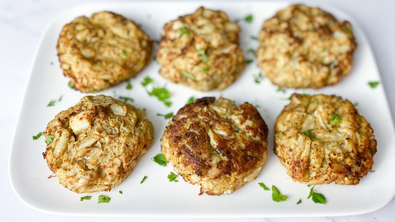 plate of crab cakes with garnish