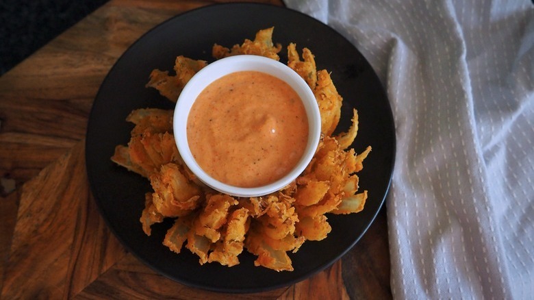 bloomin' onion with dipping sauce