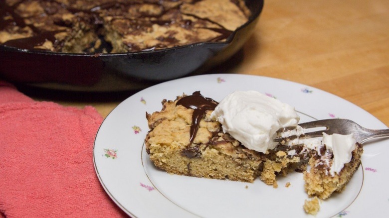 A slice of cookie cake on a plate