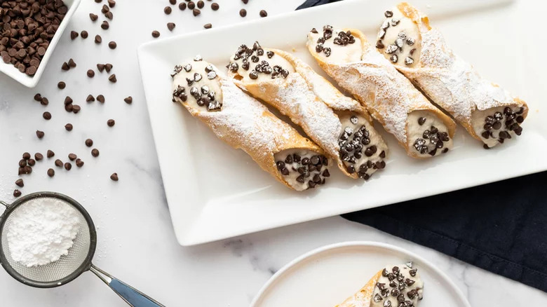 A plate of chocolate chip cannolis