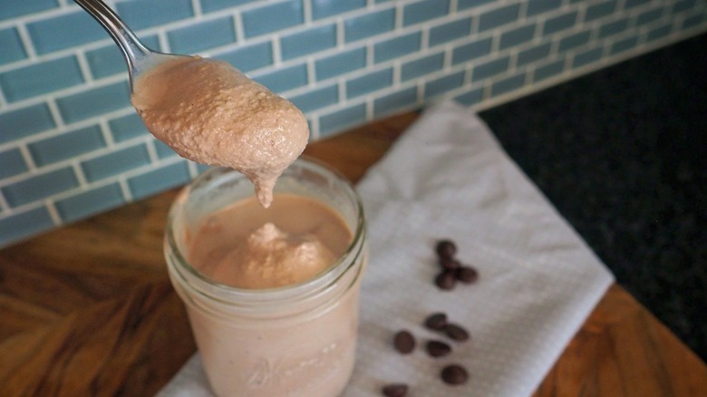 A jar and spoon of Wendy's frosty