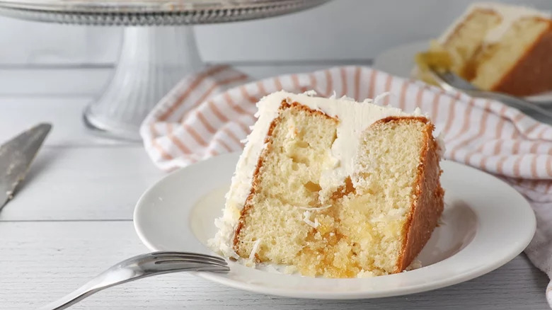 slice of frosted cake on a plate