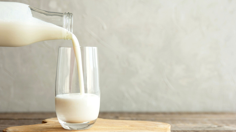 pouring a glass of milk