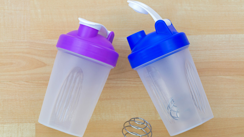 two blender bottles with flip lid