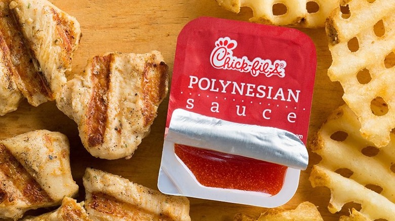 grilled nuggets waffle fries and open polynesian sauce packet