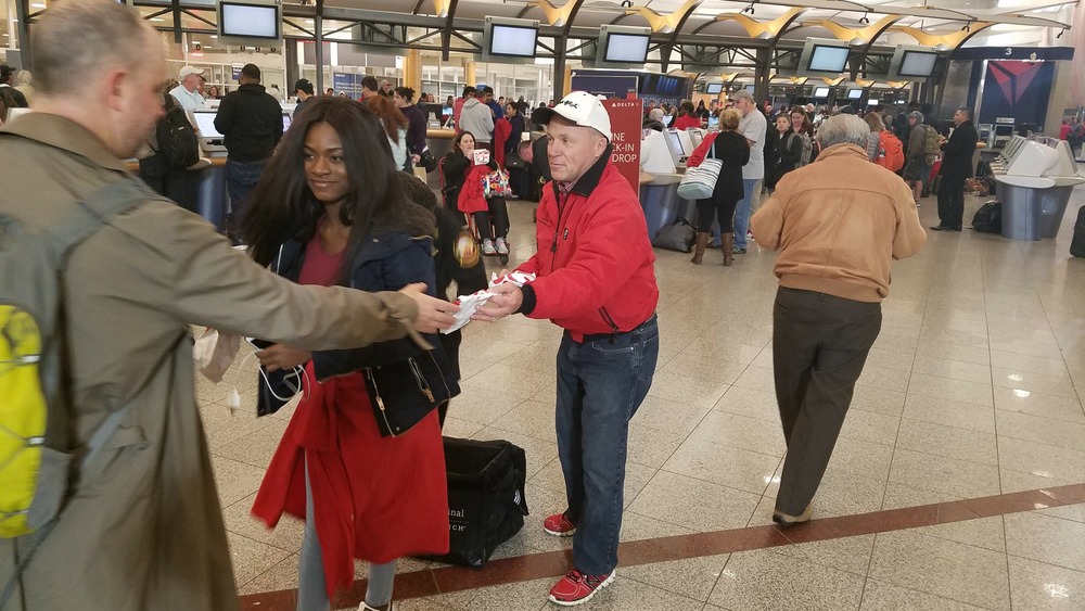 Chick-fil-A CEO handing out sandwiches at Atlanta airport