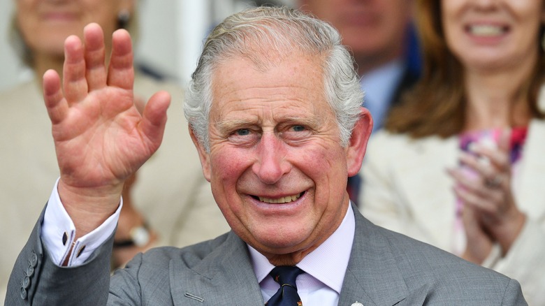 King Charles III waving to crowd