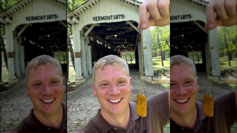 Andrew Maas holding golden ticket necklace