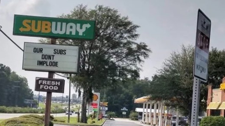 Subway sign reading "our subs don't implode"